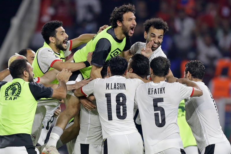 The Pharoahs celebrate after winning a penalty shootout against hosts Cameroon in the Africa Cup of Nations semi-final. AP