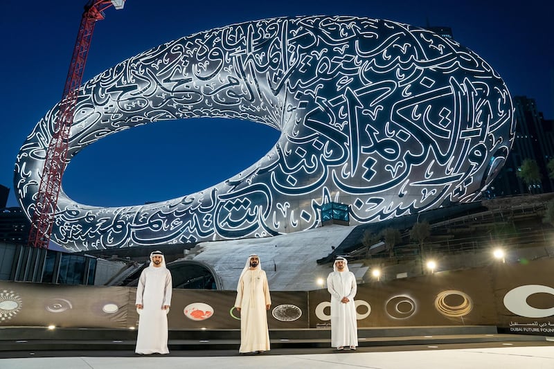 Sheikh Mohammed Bin Rashid, Vice-President and Prime Minister of the UAE and Ruler of Dubai, witnesses the installation of the final piece of façade of Museum of the Future. Seen with Sheikh Hamdan bin Mohammed bin Rashid Al Maktoum, Dubai Crown Prince and Chairman of The Executive Council of Dubai and Chairman of the Board of Trustees of Dubai Future Foundation; and Sheikh Maktoum bin Mohammed bin Rashid Al Maktoum, Deputy Ruler of Dubai. Courtesy Museum of the Future