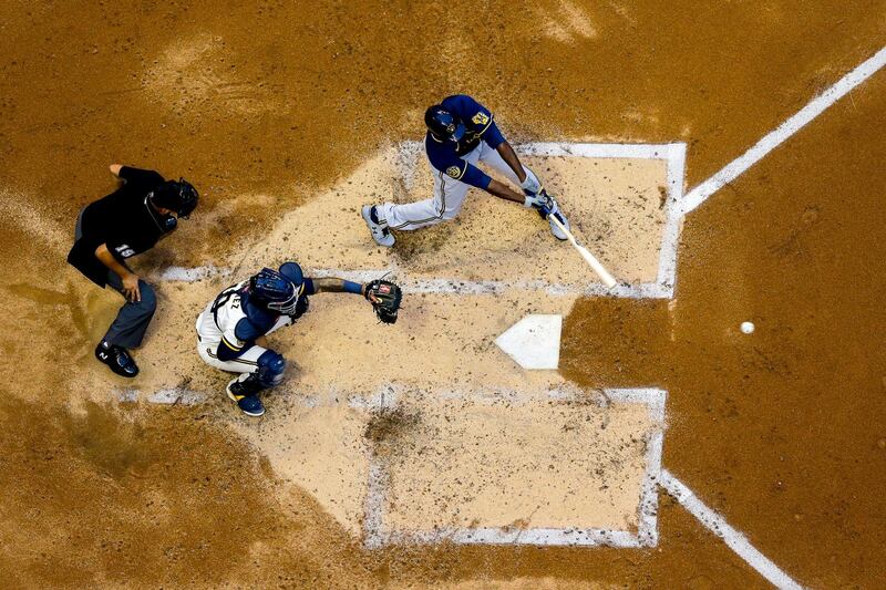 Milwaukee Brewers' Lorenzo Cain hits a single during an intra-squad game on July 14, at Miller Park in Milwaukee. AP