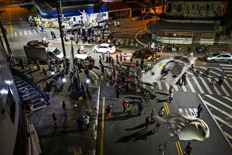 Fans gather outside the Vila Belmiro stadium in Santos to mourn and pay respects to Pele. AP