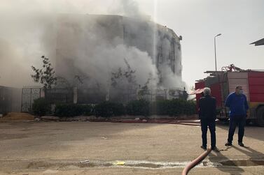 Smoke pours from the garment factory north of Cairo, Egypt. Reuters