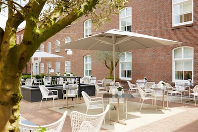 The former prison yard is now lined with olive trees and home to an organic herb garden. Courtesy Hotel Het Arresthuis  