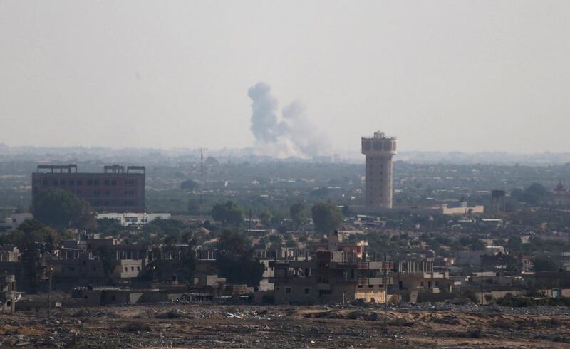 Smoke rises in the northern Sinai Peninsula as seen from Egypt's border with the Gaza Strip on July 1, 2015. Ibraheem Abu Mustafa / Reuters