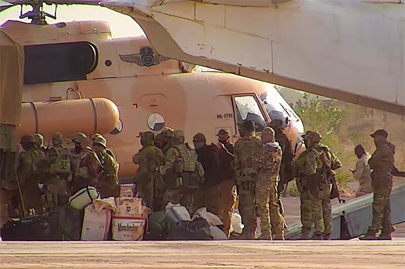 Russian mercenaries board a helicopter in northern Mali. AP