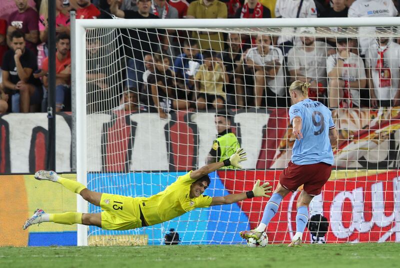 Erling Haaland scores the third goal past Sevilla's Moroccan goalkeeper Yassine Bounou. AFP