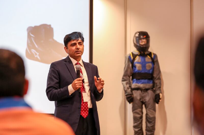 Arif Mehmood, a safety planning specialist at the Department of Transport, educates the riders on the importance of wearing safety gear and following traffic laws.