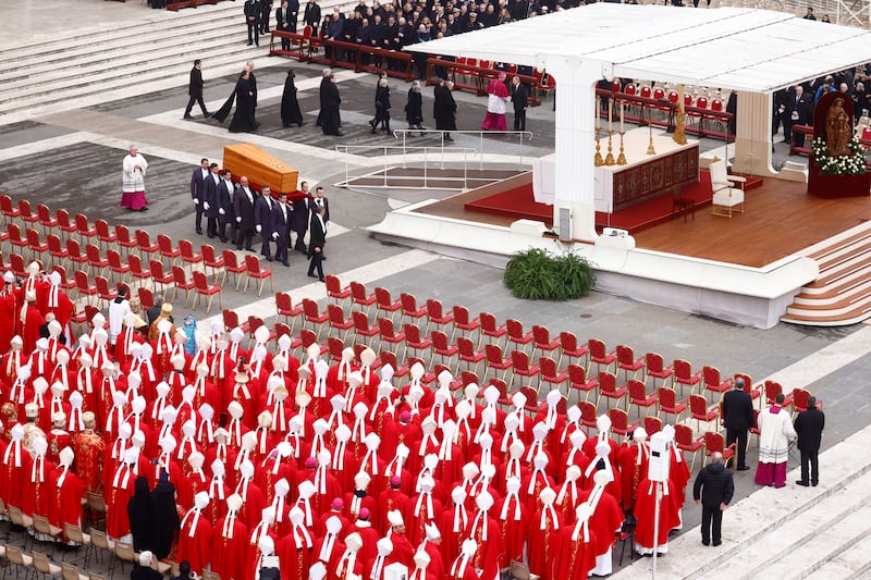 The coffin is carried through St Peter's Square. Reuters