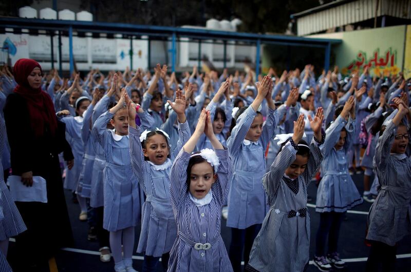 Palestinian schoolgirls exercise in Gaza City. Reuters