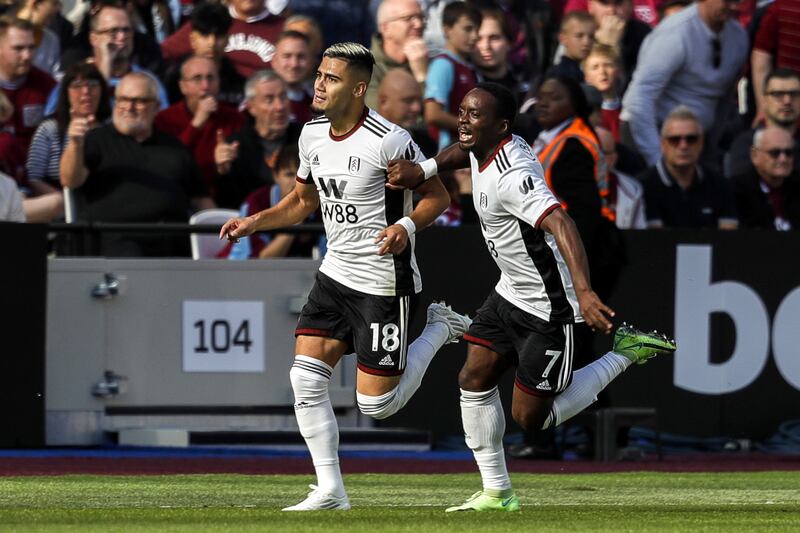 Andreas Pereira celebrates scoring Fulham's first goal with teammate Neeskens Kebano. PA