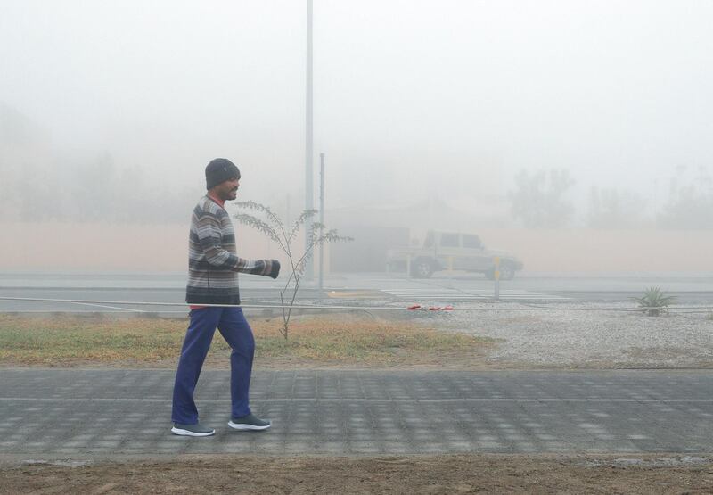 Abu Dhabi, United Arab Emirates, December 30, 2019.  
A morning fitness buff takes a walk on a foggy morning at Khalifa City, Abu Dhabi.
Victor Besa / The National
Section:   NA 
Reporter:
