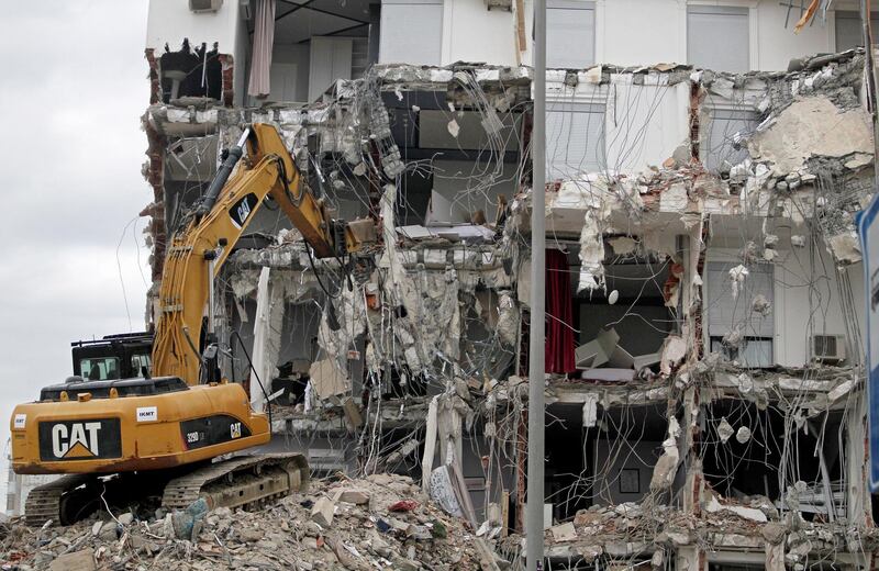 An excavator works at a damaged building in Durres, Albania. EPA