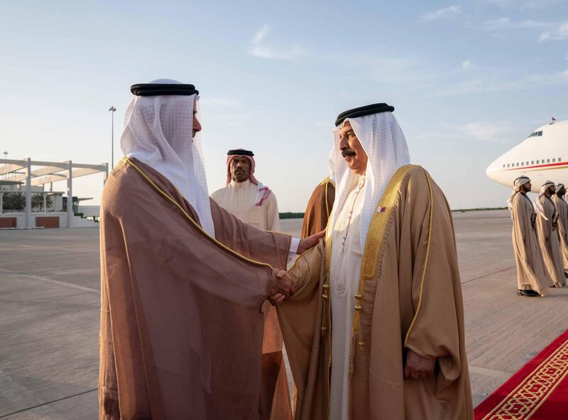 ABU DHABI, UNITED ARAB EMIRATES - May 23, 2019: HH Lt General Sheikh Saif bin Zayed Al Nahyan, UAE Deputy Prime Minister and Minister of Interior (L), greets HM King Hamad bin Isa Al Khalifa, King of Bahrain (R), at Al Bateen Airport. 

( Mohamed Al Hammadi / Ministry of Presidential Affairs )
---