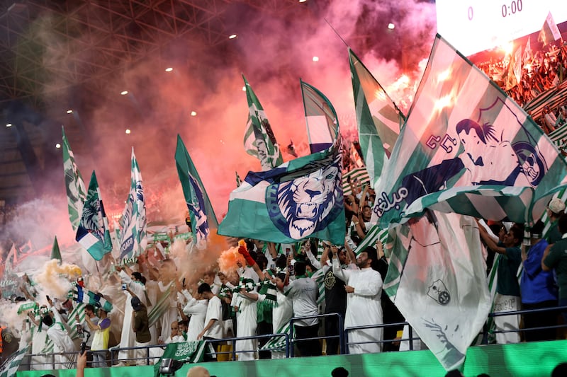 Soccer Football - Saudi Pro League - Al Nassr v Al Ahli - Al-Awwal Park, Riyadh, Saudi Arabia - September 22, 2023 Al Ahli fans with flags and flares REUTERS / Ahmed Yosri