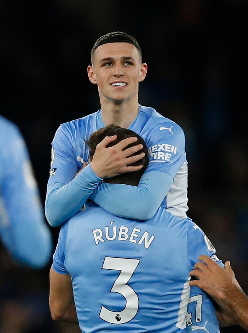 Foden celebrates sealing the win that took City top. Reuters