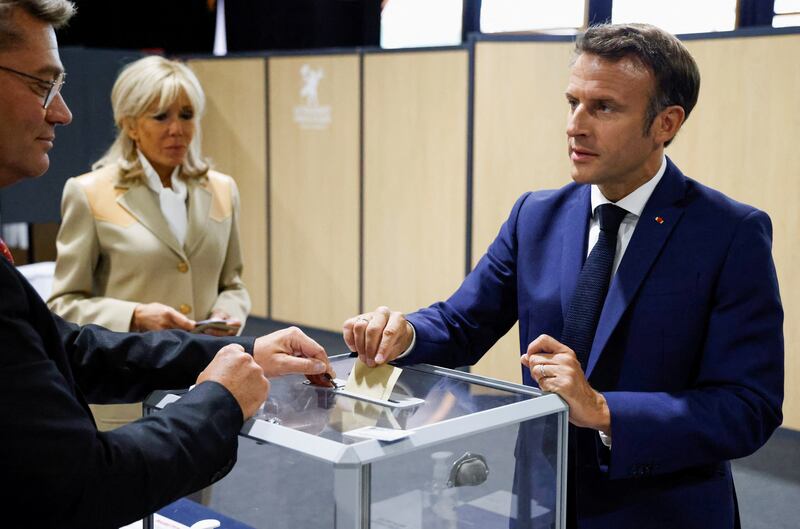 French President Emmanuel Macron casts his vote in the first round of parliamentary elections, at a polling station in Le Touquet on Sunday. Reuters