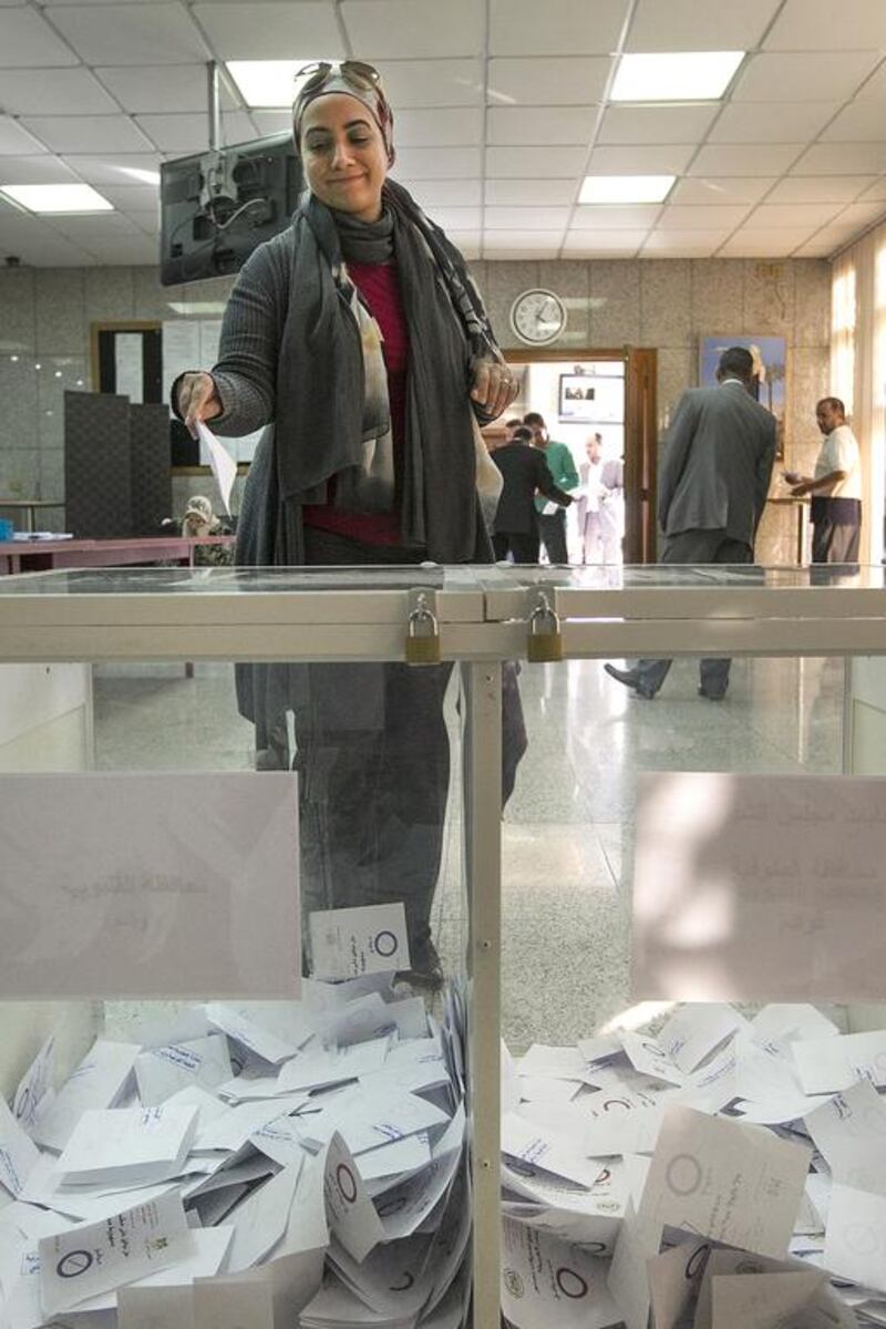 Egyptians vote for the new constitution in the Egyptian embassy in Abu Dhabi. Mona Al Marzooqi / The National 