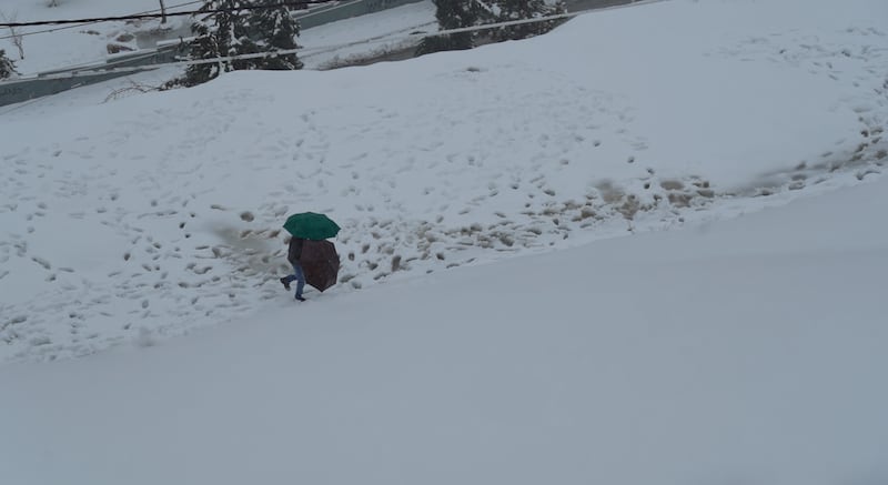 People in Amman woke to find Jordan's capital covered in snow on Thursday.