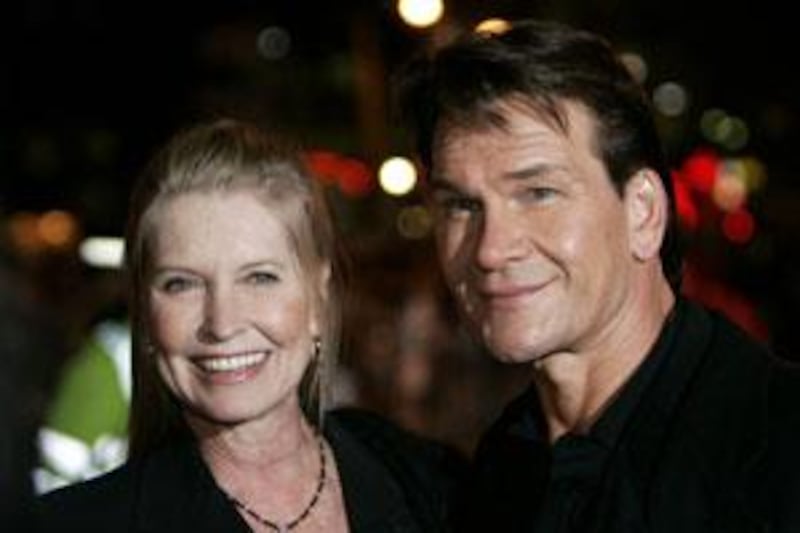 Patrick Swayze and his wife Lisa Niemi pose before attending a film premiere in London in 2005.
