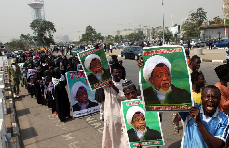 (FILES) In this file photo taken on January 22, 2019 members of Islamic Movement in Nigeria take part in a demonstration against the detention of their leader Ibrahim Zakzaky, in Abuja. Nigeria's presidency on July 28, 2019 said the government was banning a Shiite group after a spate of deadly clashes at protests in the capital. Tensions have risen between the authorities and the Islamic Movement of Nigeria (IMN) as demonstrations in Abuja to free pro-Iranian leader Ibrahim Zakzaky have descended into violence. / AFP / SODIQ ADELAKUN
