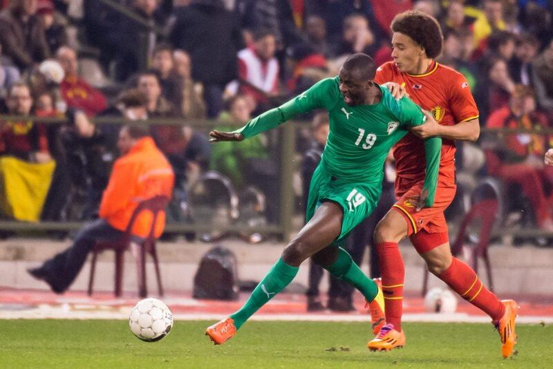 Yaya Toure and Ivory Coast drew Belgium 2-2. They'll play in Group C at the 2014 World Cup with Colombia, Greece and Japan. Geert Vanden Wijngaert / AP