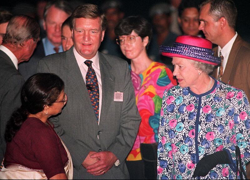 Queen Elizabeth arrives in New Delhi on October 12, 1997 for a six-day visit. The 71-year-old monarch, accompanied by the Duke of Edinburgh, was met at the airport by Indian junior foreign minister Kamla Sinha, left. AFP