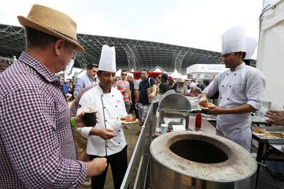 ABU DHABI , UNITED ARAB EMIRATES Ð Nov 7 , 2014 : People trying food at different restaurant in the Taste of Abu Dhabi held at Du Arena at Yas Island in Abu Dhabi. ( Pawan Singh / The National ) For Arts & Life. Story by Stacie Johnson
