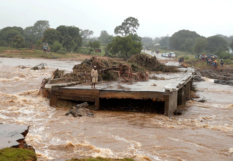 A man looks at a washed away bridge along Umvumvu river following Cyclone Idai in Chimanimani, Zimbabwe. Reuters