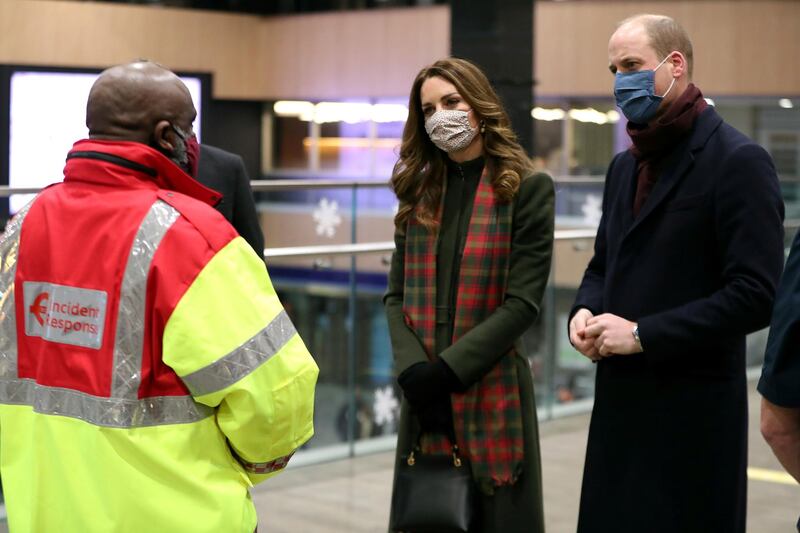 Prince William and Catherine, Duchess of Cambridge, speak to transport workers at London Euston Station, as they embark on a tour aboard the Royal Train to thank frontline staff and community workers in the UK. Reuters