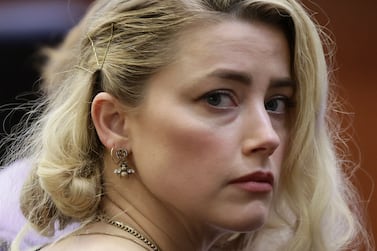 (FILES) In this file photo taken on June 01, 2022 Actor Amber Heard waits before the jury said that they believe she defamed ex-husband Johnny Depp while announcing split verdicts in favor of both her ex-husband Johnny Depp and Heard on their claim and counter-claim in the Depp v.  Heard civil defamation trial at the Fairfax County Circuit Courthouse in Fairfax, Virginia.  - Amber Heard stands by "every word" of her testimony during the defamation trial against former husband Johnny Depp, she said in an interview released June 14, 2022.  (Photo by EVELYN HOCKSTEIN  /  POOL  /  AFP)