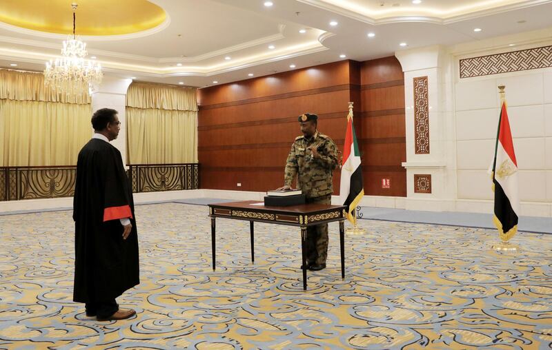 Leader of Sudan's transitional council, Lieutenant General Abdel Fattah Al-Abdelrahman Burhan is sworn in as the Head of the newly formed, the Sovereign Council, at the presidential palace in Khartoum, Sudan. Reuters