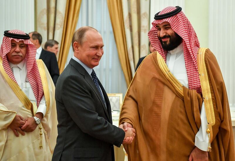 FILE - In this Thursday, June 14, 2018, file photo, President Vladimir Putin, shakes hands with Saudi Arabian Crown Prince Mohammed bin Salman, right, during their meeting in Moscow, Russia. Prince Mohammed is expected to hold bilateral talks with Putin at the G20 in Buenos Aires. (Yuri Kadobnov/Pool Photo via AP, File)