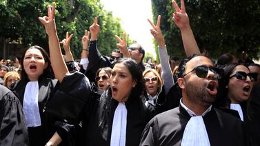 Tunisian lawyers take part in a protest against the recent arrests of their colleagues, in Tunis. AP
