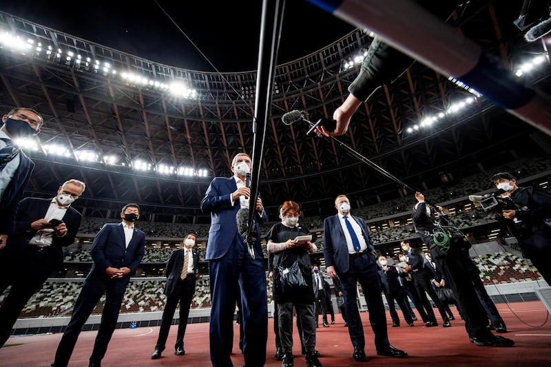 Thomas Bach, IOC president, speaks to the media as he visits the National Stadium. Reuters