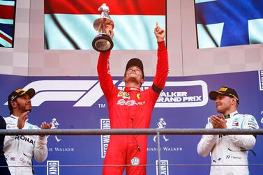 Charles Leclerc, centre, celebrates on the top step of the podium after winning the Belgian Grand Prix. EPA