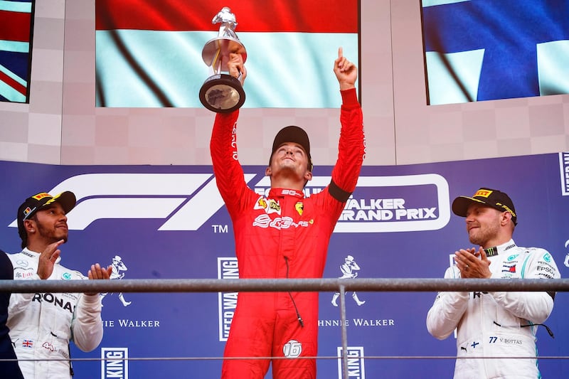 epa07810461 Monaco's Formula One driver Charles Leclerc (C) of Scuderia Ferrari celebrates on the podium after his first career win in the 2019 Formula One Grand Prix of Belgium at the Spa-Francorchamps race track in Stavelot, Belgium, 01 September 2019. Leclerc won ahead of second placed British driver Lewis Hamilton (L) of Mercedes AMG GP and his third placed Finnish teammate Valtteri Bottas (R).  EPA/VALDRIN XHEMAJ