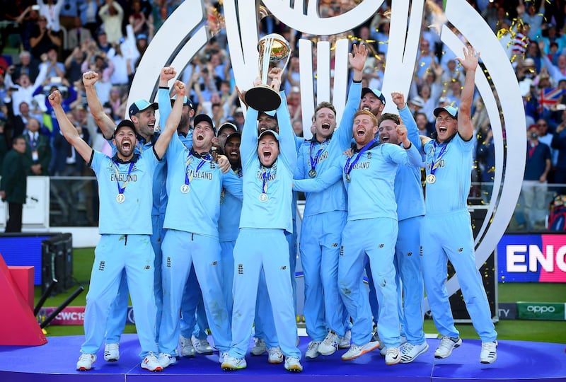 LONDON, ENGLAND - JULY 14:  Eoin Morgan of England celebrates with his team as he lifts the Cricket World Cup trophy after the Final of the ICC Cricket World Cup 2019 between New Zealand and England at Lord's Cricket Ground on July 14, 2019 in London, England. (Photo by Clive Mason/Getty Images)