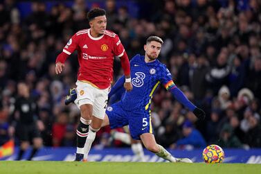 Manchester United's Jadon Sancho (left) beats Chelsea's Jorginho to go on and score their side's first goal of the game during the Premier League match at Stamford Bridge, London. Picture date: Sunday November 28, 2021.