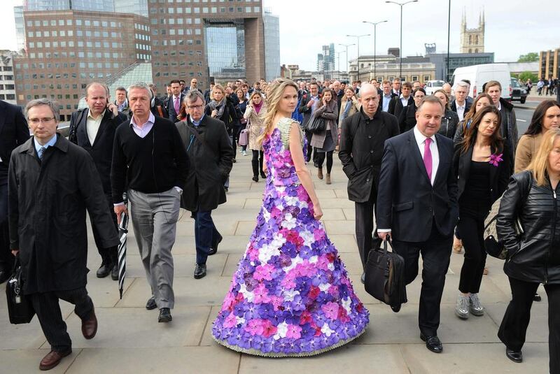Paradise Garden joins the London City commute - a dress of a 1,000 Orchids created by M&G Investments leads the way to the RHS Chelsea Flower Show sponsored by M&G Investments that opens next week. The dress made of 1,000 Orchida Vanda petals reflects the theme of M&G's own garden at the show - a contemporary paradise garden. 2014 marks the fourth year M&G Investsments have been the title sponsor of the RHS Chelsea Flower Show. This year's M&G garden is designed by Cleve West. The model's dress took over 50 hours to create and is based on the harmony and energy that has underpinned paradise gardens across the world throughout history. The RHS Chelsea Flower Show sponsored by M&G Investments opens on Tuesday 20 May and runs until Saturday 24 May 2014. Stuart C. Wilson / Getty Images for M&G Investments