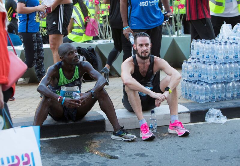 Dubai, United Arab Emirates - Participants at the finish line at the Dubai 30x30 Run at Sheikh Zayed Road.  Leslie Pableo for The National