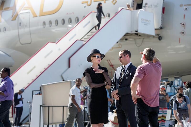 ABU DHABI, UNITED ARAB EMIRATES, Jan. 15, 2015:  
(L) Australian actress Nicole Kidman visits with a guests and staff while she works on set of an Etihad Airlines advertisement shoot on Thursday, Jan. 15, 2015, at the Etihad hangars at the Abu Dhabi International Airport.  (Silvia Razgova / The National)  /  Usage:  undated /  Section: NA   /  Reporter:  Jennifer Bell *** Local Caption ***  SR-150115-etihad-ad38.jpgSR-150115-etihad-ad38.jpg