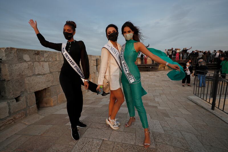 Colombia's Valeria Ayos, left, Armenia's Nane Avetisyan, centre, and India's Harnaaz Sandhu pose as members of the Miss Universe beauty pageant. EPA
