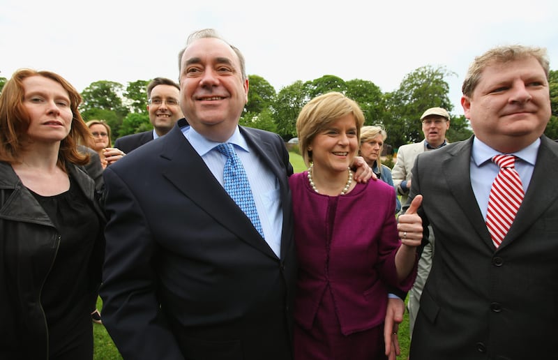 Mr Salmond arrives with Ms Sturgeon to deliver his victory speech in Edinburgh in May 2011, after the SNP secured an unprecedented victory in the Parliament elections. Getty