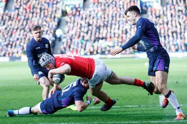 Jonathan Davies scores the second try for Wales against Scotland. EPA