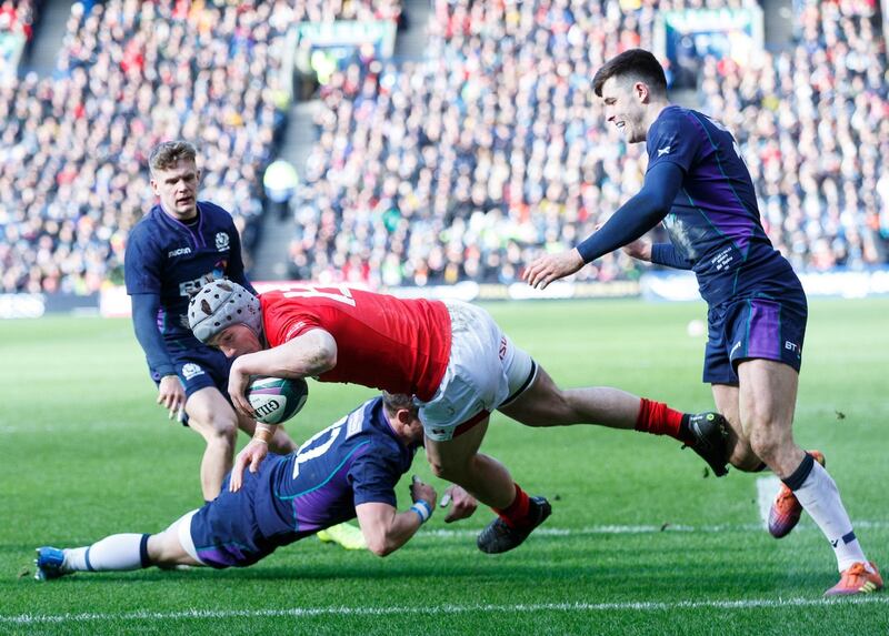 epa07424771 Jonathan Davies of Wales scores the second try during the Guinness Six Nations Rugby match Scotland v Wales in Edinburgh, Britain, 09 March 2019.  EPA/Robert Perry