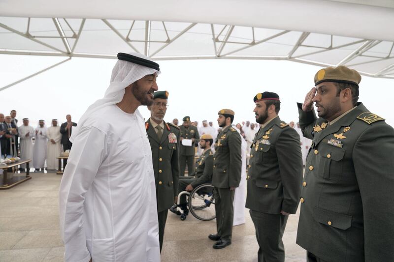 ABU DHABI, UNITED ARAB EMIRATES - April 23, 2018: HH Sheikh Mohamed bin Zayed Al Nahyan Crown Prince of Abu Dhabi Deputy Supreme Commander of the UAE Armed Forces (L), awards a member of the UAE Armed Forces with a Medal of Bravery for his service in Yemen, during a Sea Palace barza

( Mohamed Al Hammadi / Crown Prince Court - Abu Dhabi )
---