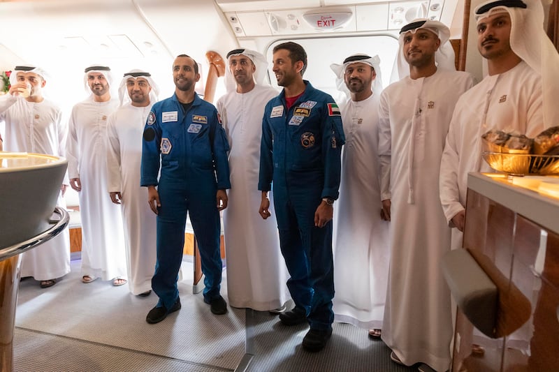 Emirati astronauts Hazza Al Mansouri and Dr Al Neyadi with MBRSC staff