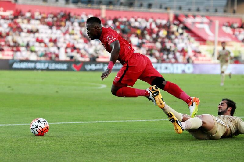 Al Ahli’s Ismail Al Hammadi (7) gets tripped by Al Shaab’s Ibrahim Qambar (2) during their Arabian Gulf League match, the final one of the season, at Rashid Stadium in Dubai on May 8, 2016. Christopher Pike / The National