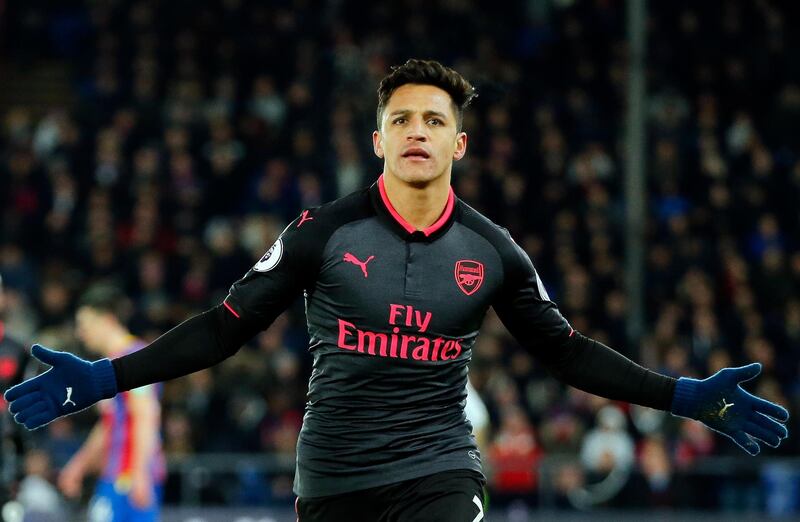 FILE - In this Thursday, Dec. 28, 2017 file photo, Arsenal's Alexis Sanchez celebrates after scoring his side's third goal of the game during their English Premier League soccer match against Crystal Palace at Selhurst Park stadium in London. Alexis Sanchez is close to joining Manchester United in what is set to be a rare swap deal among two of Englandâ€™s top teams that will see Henrikh Mkhitaryan move to Arsenal. Both players were pictured by British newspapers Monday, Jan. 22, 2018 entering an office in Liverpool to update their work permits. (AP Photo/Alastair Grant, file)