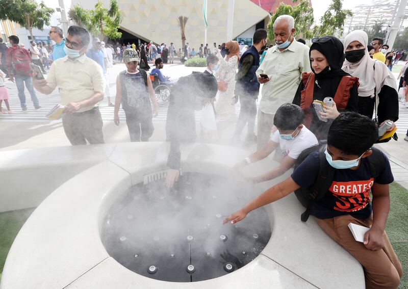 Visitors cool off on a sizzling Sunday at the world’s fair