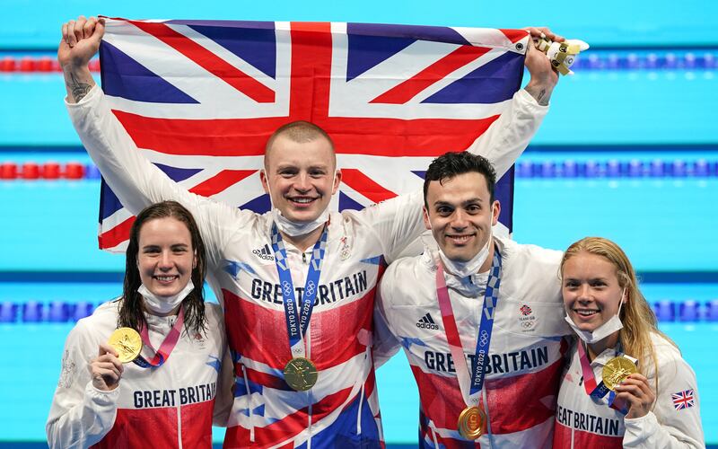 Great Britain's Kathleen Dawson, Adam Peaty, James Guy and Anna Hopkin with their gold medals for the mixed 4 x 100m medley relay.